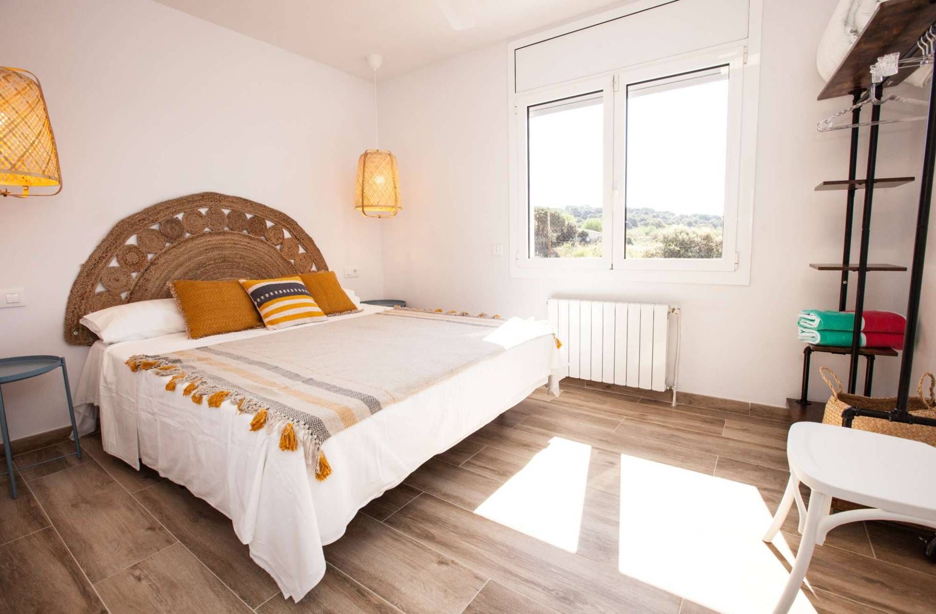 Bright, friendly Casa Azulino bedroom with double bed and natural decor. High-quality retreat for active guests and holidaymakers.